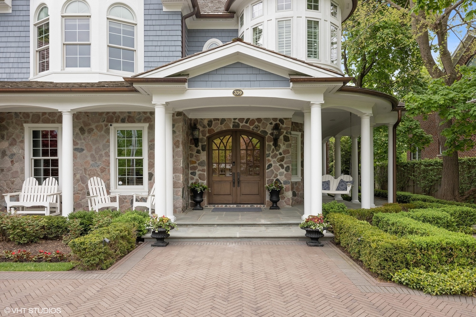 339 Linden Street Winnetka, IL 60093 - Photo 3 of 69 front view of a building with a outdoor space