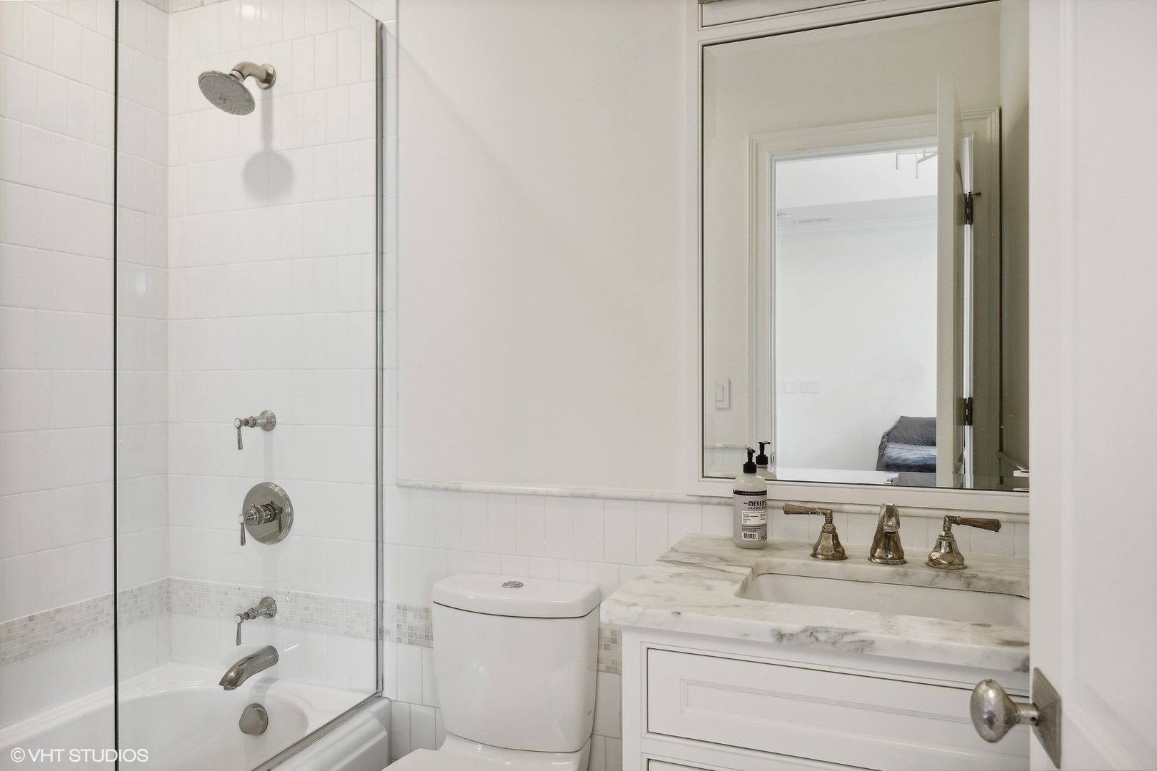 339 Linden Street Winnetka, IL 60093 - Photo 39 of 69 a bathroom with a granite countertop sink a toilet and shower