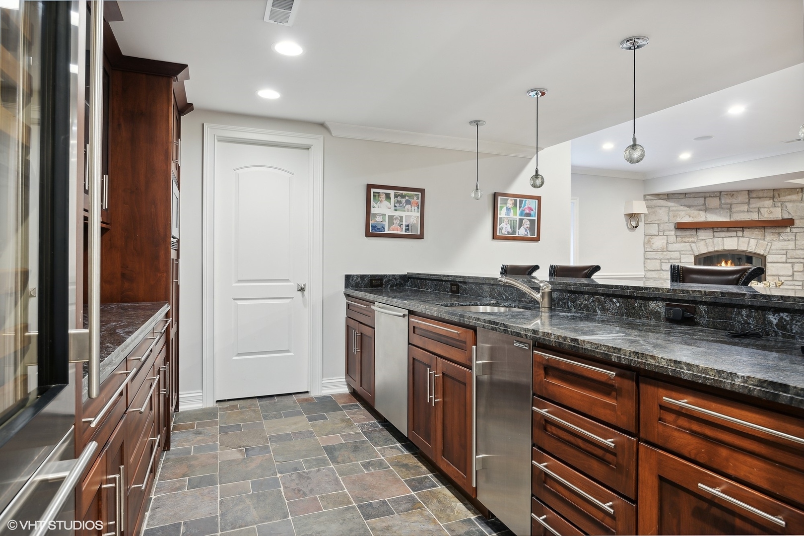 339 Linden Street Winnetka, IL 60093 - Photo 45 of 69 a kitchen with stainless steel appliances granite countertop a sink and a refrigerator