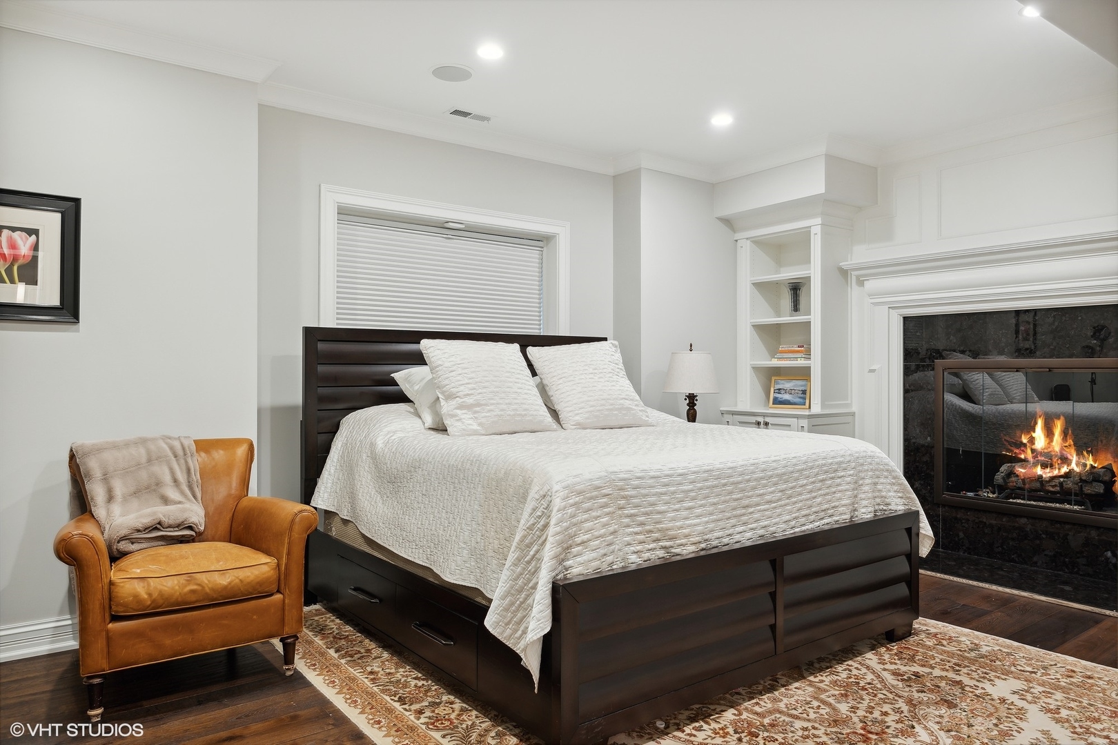 339 Linden Street Winnetka, IL 60093 - Photo 50 of 69 a bedroom with a bed couch and a fireplace