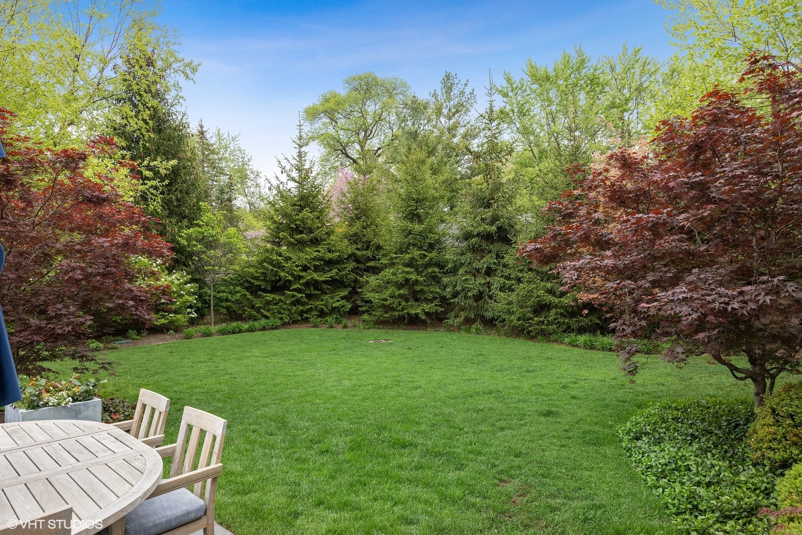 339 Linden Street Winnetka, IL 60093 - Photo 61 of 69 a view of a chair and table on the green field