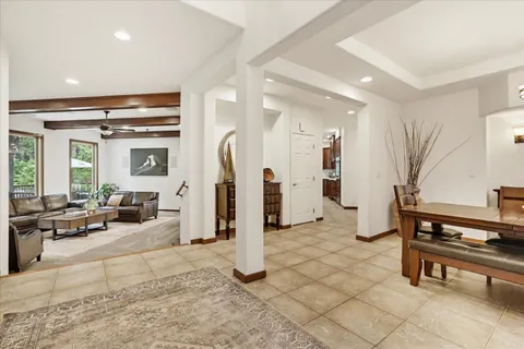 a view of a dining room with furniture wooden floor and chandelier