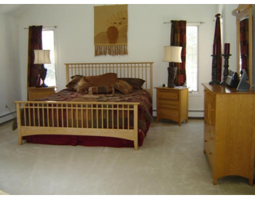 52 Eliot Hill Road Natick, MA 01760 - Photo 16 of 28 a bed sitting in a bedroom next to a window