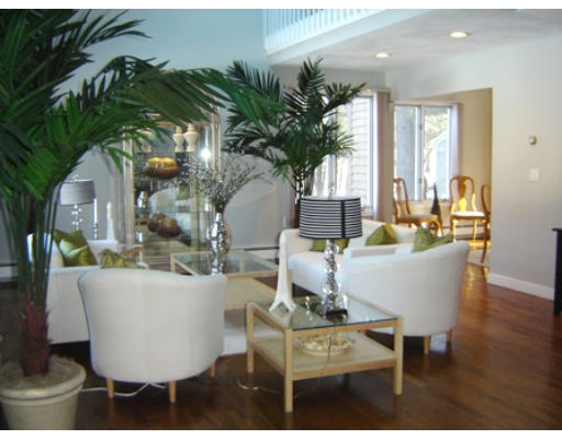 52 Eliot Hill Road Natick, MA 01760 - Photo 2 of 28 a living room with a couch and a potted plant