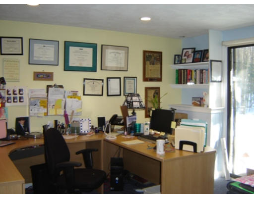 52 Eliot Hill Road Natick, MA 01760 - Photo 24 of 28 a living room with furniture and a table