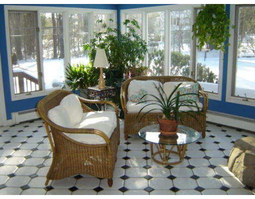 52 Eliot Hill Road Natick, MA 01760 - Photo 27 of 28 a living room filled with furniture and a potted plant