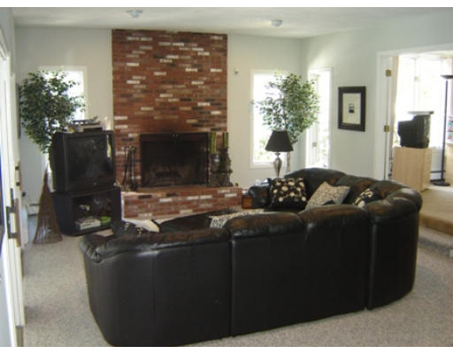 52 Eliot Hill Road Natick, MA 01760 - Photo 8 of 28 a living room with furniture windows and a fireplace