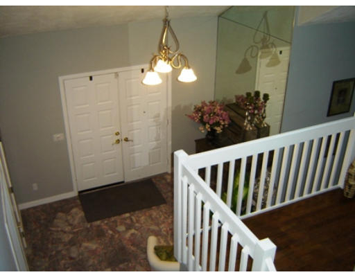 52 Eliot Hill Road Natick, MA 01760 - Photo 10 of 28 a view of a hallway view with wooden floor and staircase