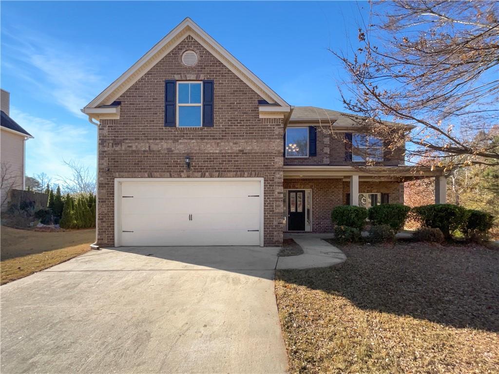 2879 Valaise Lane Lithonia, GA 30038 - Photo 1 of 25 a front view of a house with a yard