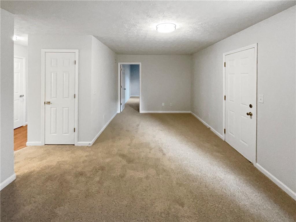 2879 Valaise Lane Lithonia, GA 30038 - Photo 17 of 25 an empty room with a natural light