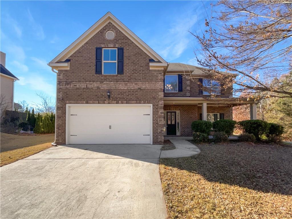 2879 Valaise Lane Lithonia, GA 30038 - Photo 2 of 25 a front view of a house with a yard