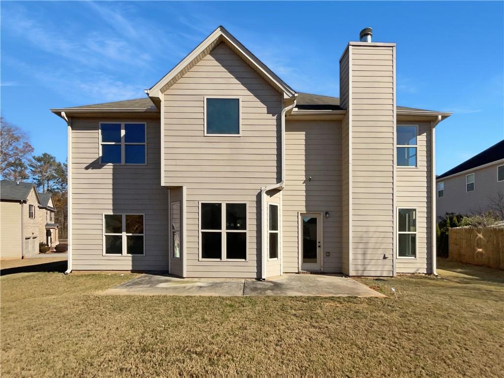 2879 Valaise Lane Lithonia, GA 30038 - Photo 24 of 25 a front view of a house with a yard