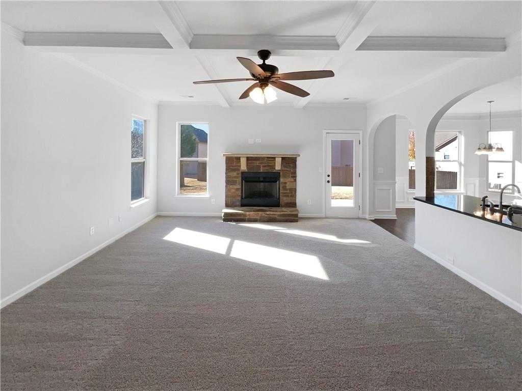 2879 Valaise Lane Lithonia, GA 30038 - Photo 3 of 25 a view of a livingroom with a fireplace a ceiling fan and windows