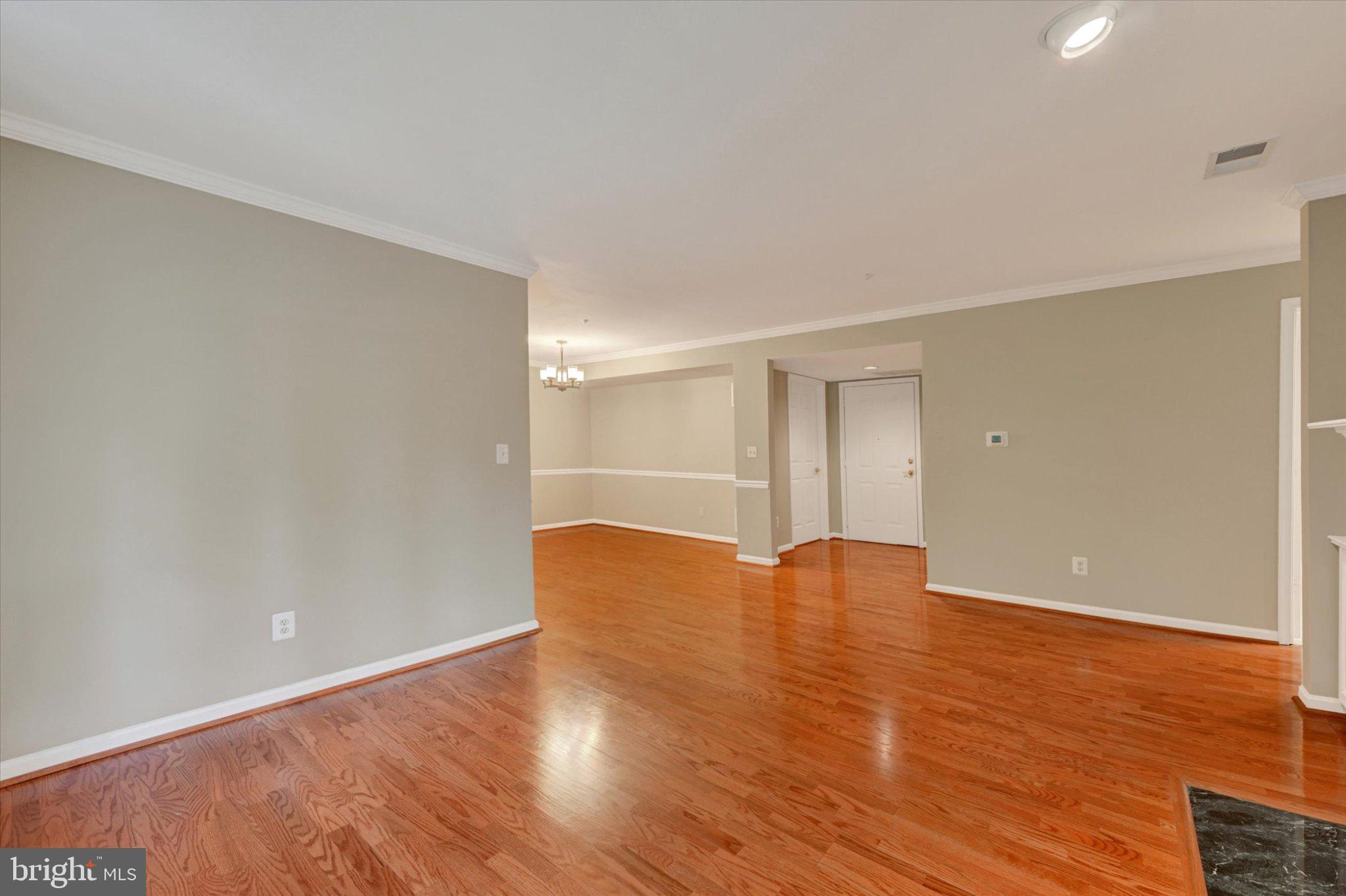12310 Rosslare Ridge Road, Unit 405 Lutherville-Timonium, MD 21093 - Photo 7 of 36 Spacious, inviting hardwood living area.