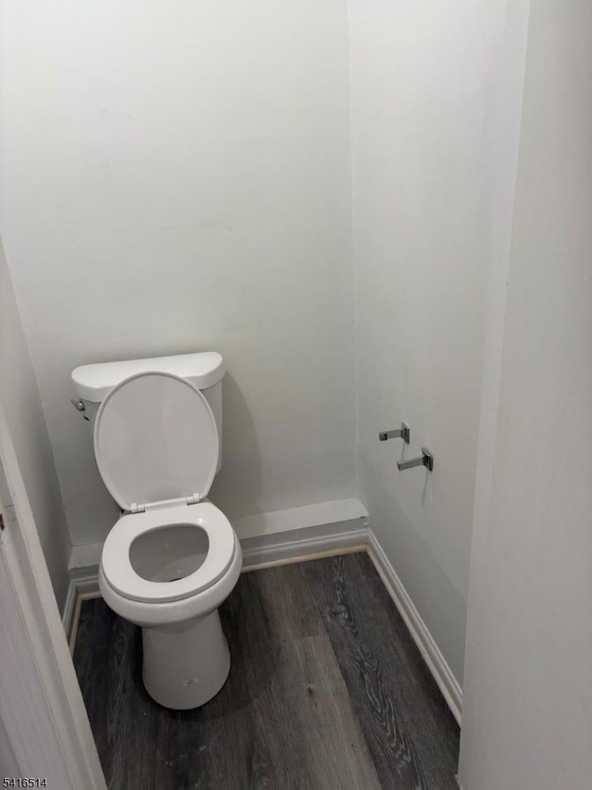 30 Cedar Street Hillside, NJ 07205 - Photo 6 of 10 a white toilet sitting in a bathroom