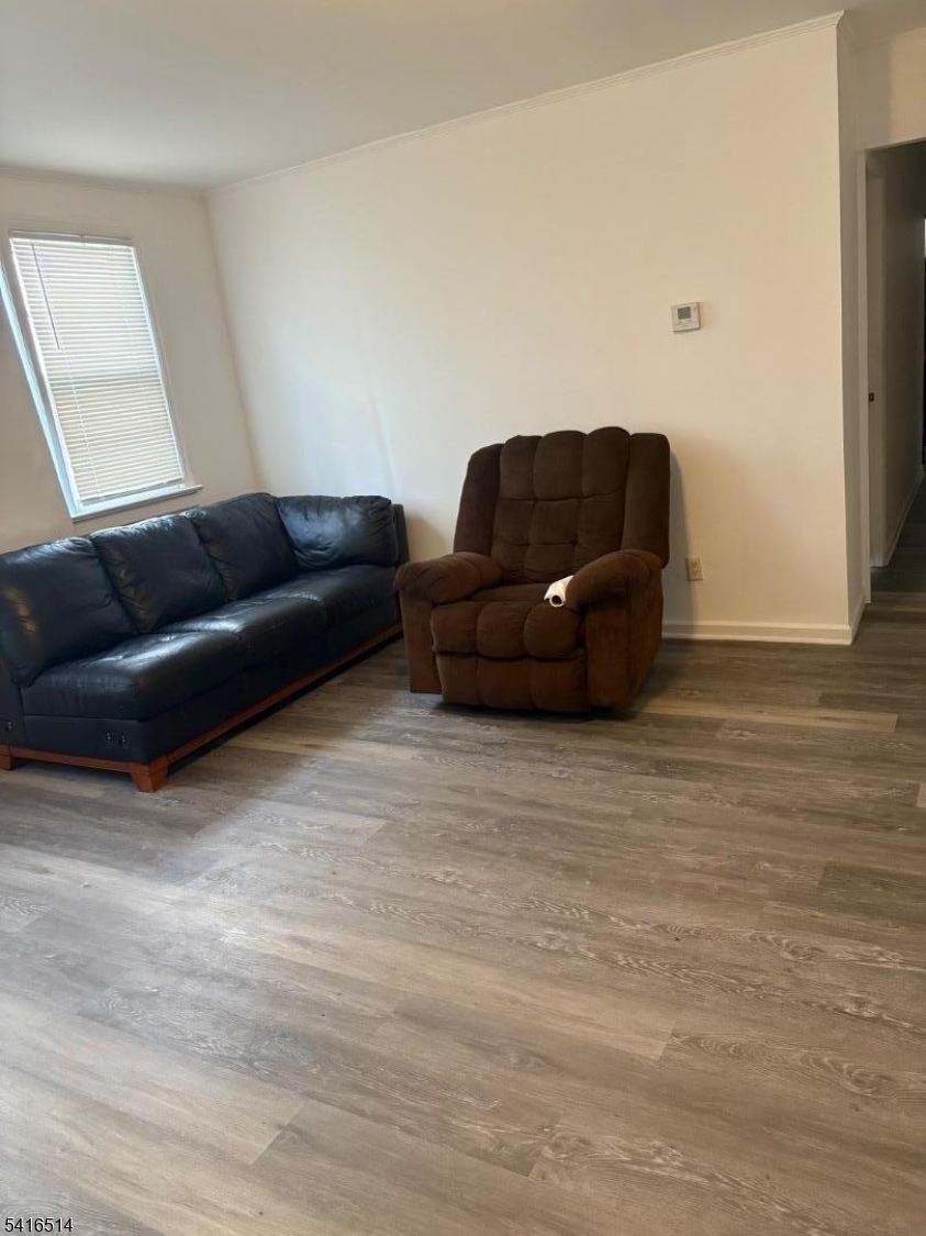 30 Cedar Street Hillside, NJ 07205 - Photo 9 of 10 a living room with furniture and a couch