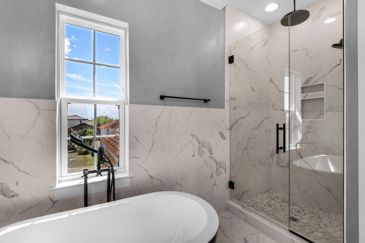 263 Calusa Boulevard Destin, FL 32541 - Photo 3 of 12 a bathroom with a toilet a sink and shower