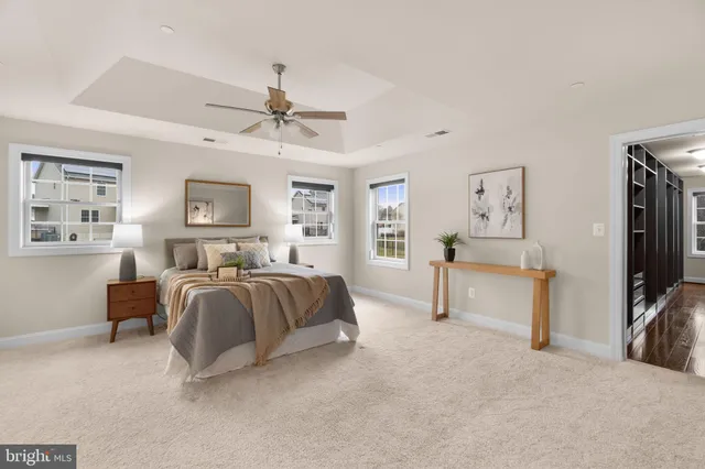 a bedroom with bed and a flat screen tv
