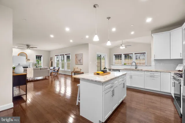 a kitchen with sink and cabinets