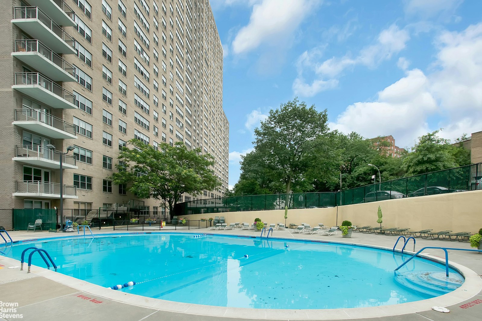 555 Kappock Street, Unit 2E Bronx, NY 10463 - Photo 35 of 39 a view of a swimming pool with a yard