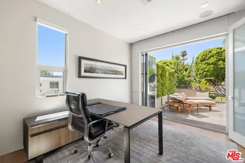 a view of a tables and chairs in the patio