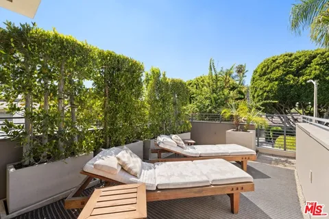 a bathroom with a granite countertop sink a mirror and a shower