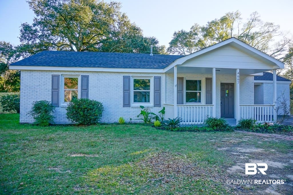 4667 Cottonwood Drive Mobile, AL 36608 - Photo 2 of 21 Ranch-style house featuring a porch and a front lawn