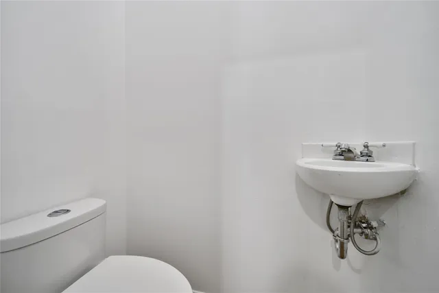 a bathroom with a sink and a toilet