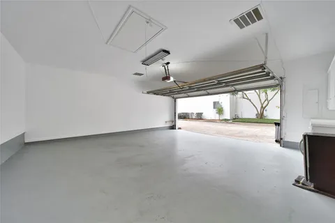 a view of empty room with floor to ceiling window