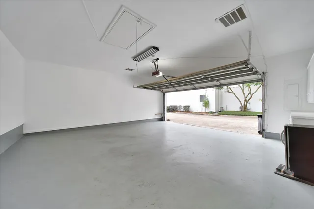 a view of empty room with floor to ceiling window