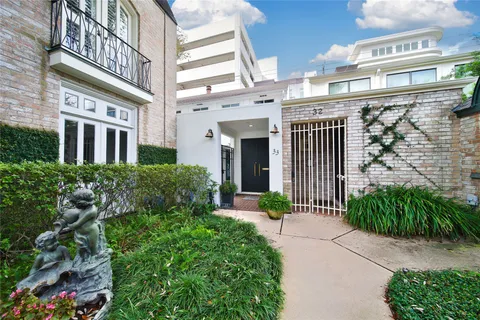 a front view of a building with garden