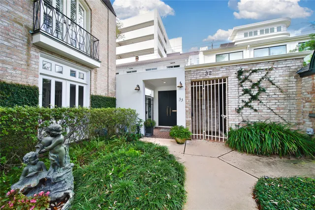 a front view of a building with garden