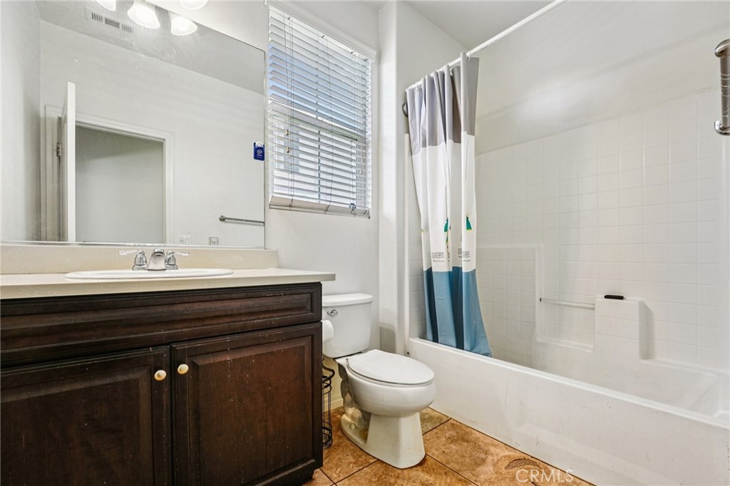 12936 Canopy Court Rancho Cucamonga, CA 91739 - Photo 11 of 32 a bathroom with a sink a toilet and shower
