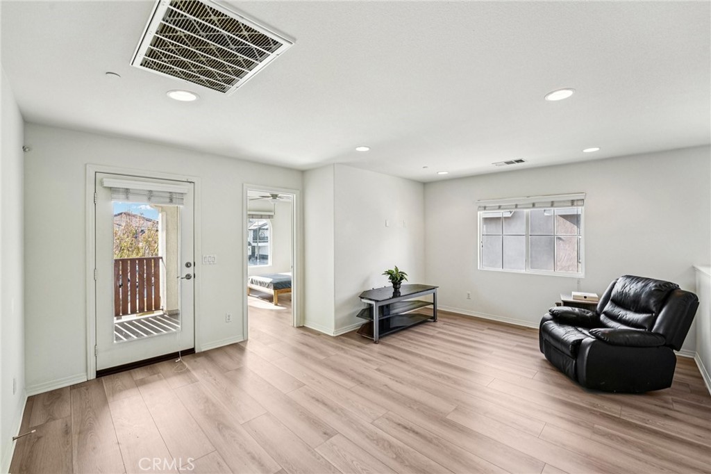 12936 Canopy Court Rancho Cucamonga, CA 91739 - Photo 13 of 32 a living room with furniture and wooden floor