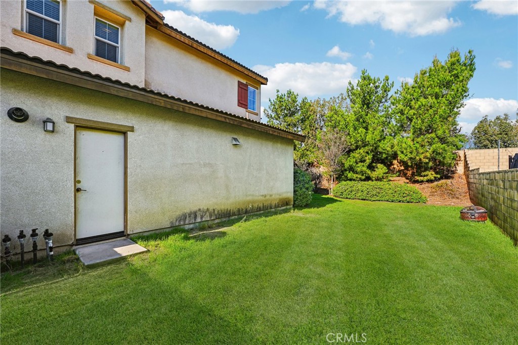 12936 Canopy Court Rancho Cucamonga, CA 91739 - Photo 30 of 32 a front view of house with yard