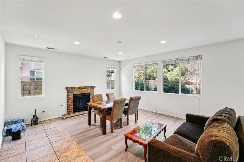12936 Canopy Court Rancho Cucamonga, CA 91739 - Photo 3 of 32 a living room with furniture and a fireplace