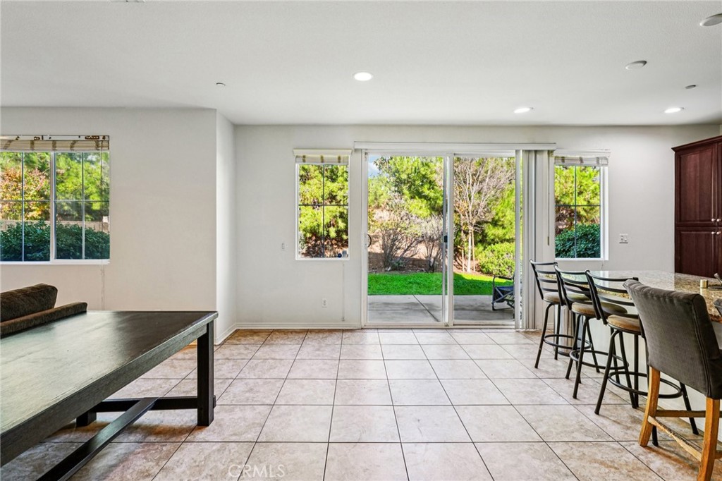 12936 Canopy Court Rancho Cucamonga, CA 91739 - Photo 5 of 32 a view of a dining room with furniture window and outside view