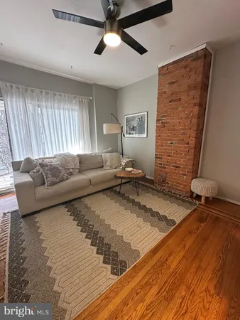 a living room with a couch and a rug
