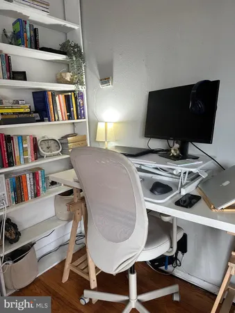a view of a workspace with furniture