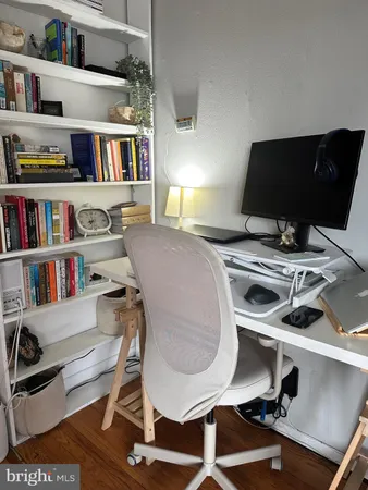 a workspace with furniture and book shelf