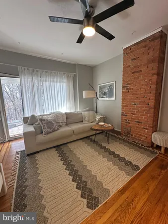 a living room with furniture and a rug