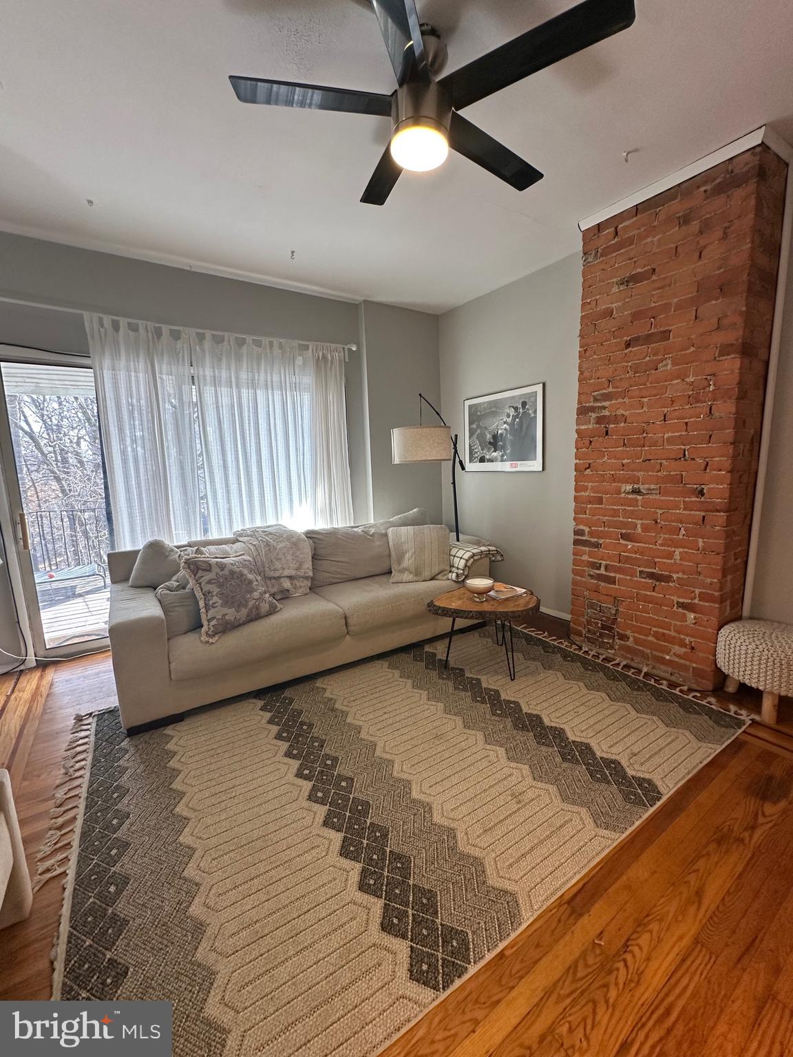 275 Rochelle Avenue, Unit 2 Philadelphia, PA 19128 - Photo 2 of 18 a living room with furniture and a rug