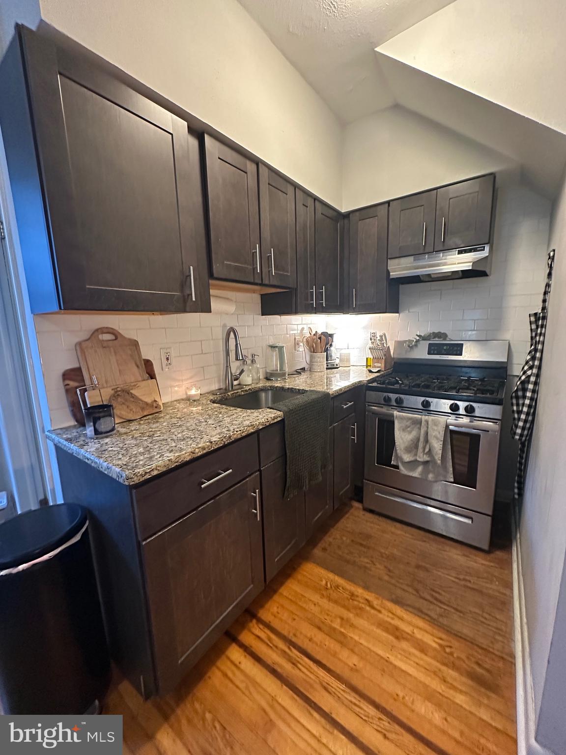 275 Rochelle Avenue, Unit 2 Philadelphia, PA 19128 - Photo 6 of 18 a kitchen with a sink stove and cabinets