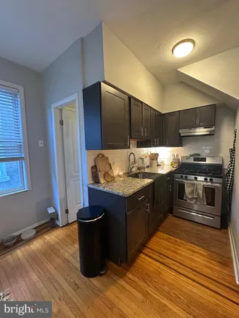 a kitchen with a stove and a refrigerator