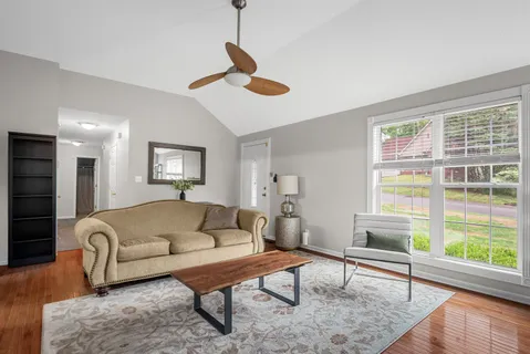 a living room with furniture and a window
