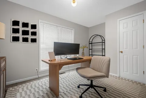 a workspace with furniture and window