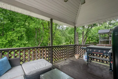 a view of a chair and table in the balcony