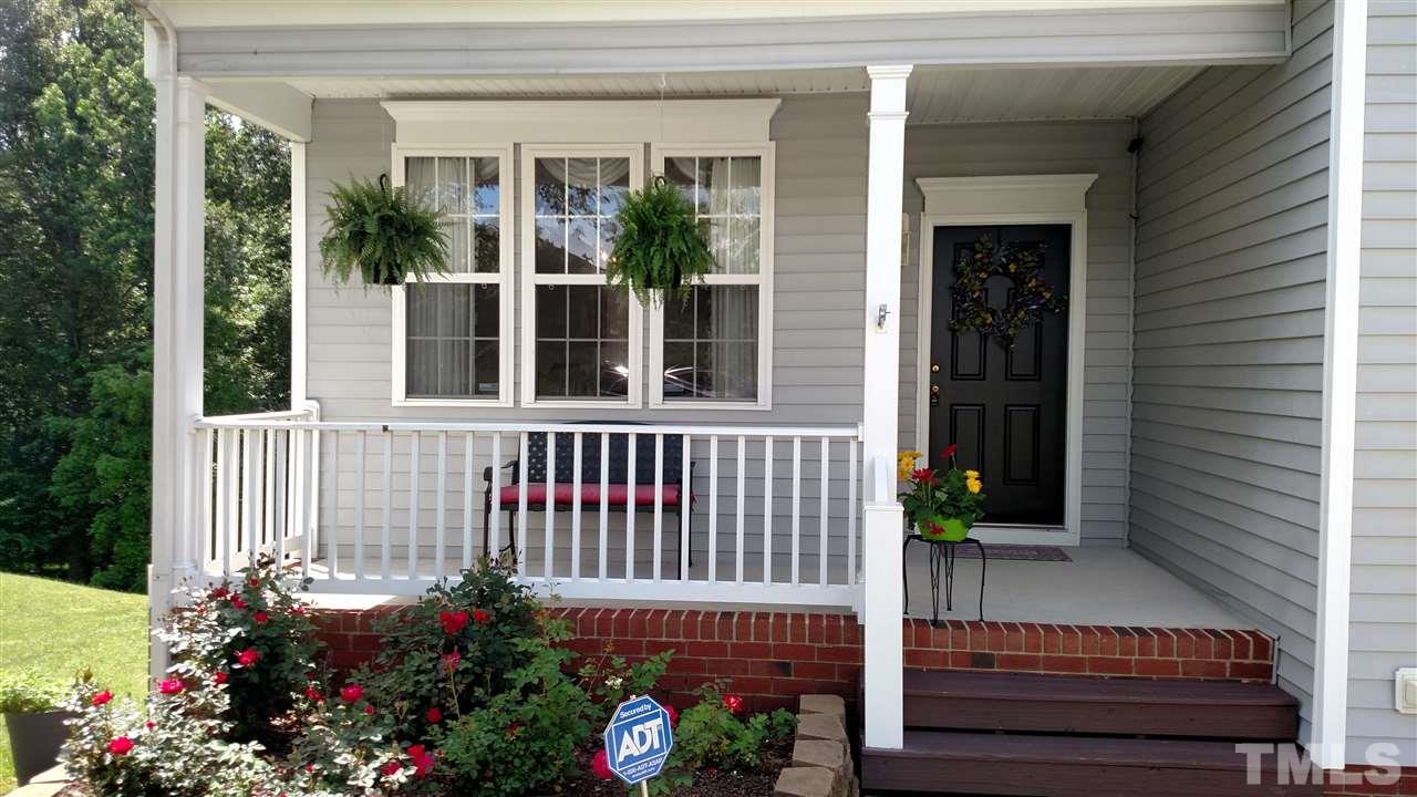 2304 Spruce Shadows Lane Raleigh, NC 27614 - Photo 1 of 25 front view of a house with a small yard