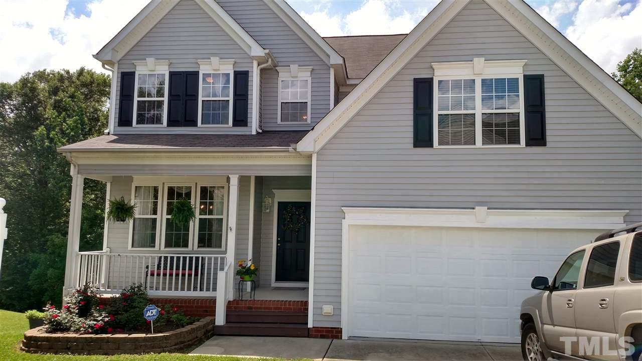 2304 Spruce Shadows Lane Raleigh, NC 27614 - Photo 2 of 25 a front view of a house with a garden