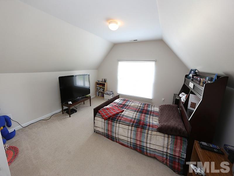 2304 Spruce Shadows Lane Raleigh, NC 27614 - Photo 16 of 25 a bedroom with bed and tv
